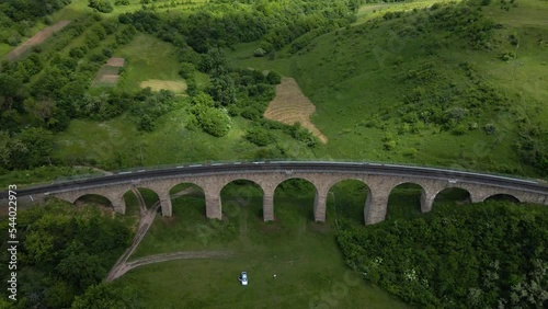 Aerial view of an old railway viaduct, Austro-Hungarian railway bridge in the village of Plebanivka in the Ternopil region of Ukraine, Travel sight points in Ukraine photo