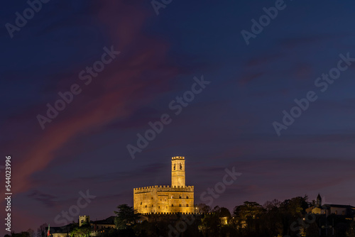 The historic center of Poppi, Arezzo, Italy, dominated by the Conti Guidi castle in the twilight light photo