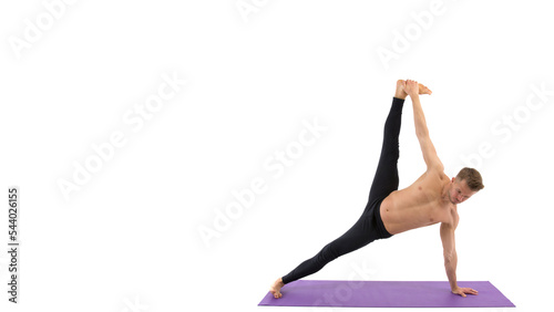 Sports and healthy lifestyle. A young athletic man is doing Pilates. White background.
