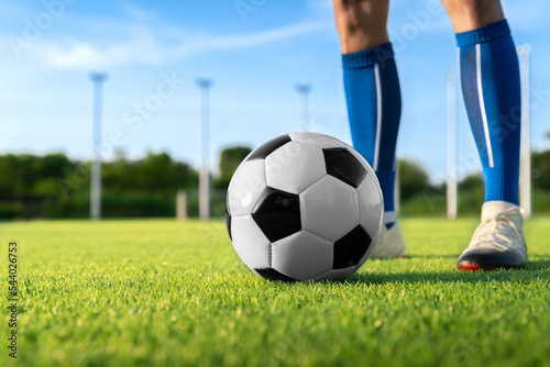 football player set ball football on grass at freekick point before shoot or kick to win a score in international league football match