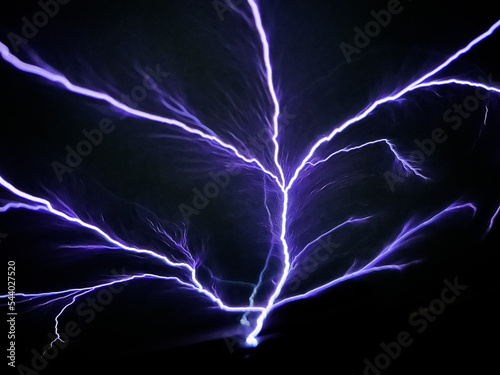 Saint elmo's fire.Lightning strike on airplane cockpit window during flying through thunderstorm clouds. Saint elmo's light. Weather phenomenon in which luminous plasma created by corona discharge. 