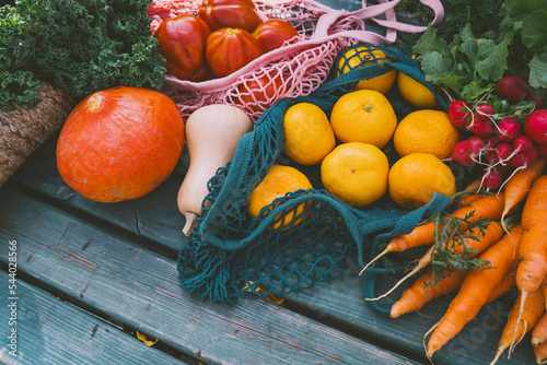 Fresh fruit and vegetables on table photo