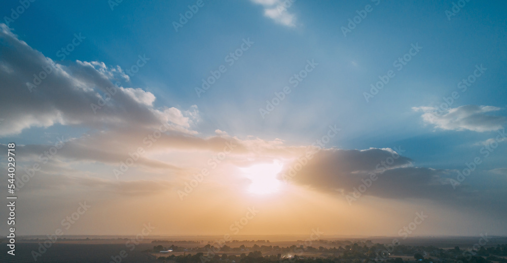 Naklejka premium Morning magic. Golden hours dawn. Drone view of sun rising up above forest trees