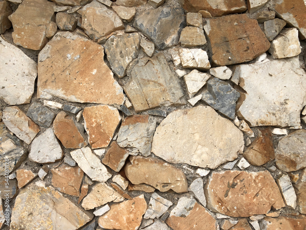 Fototapeta premium Old ancient wall with different stones as abstract background