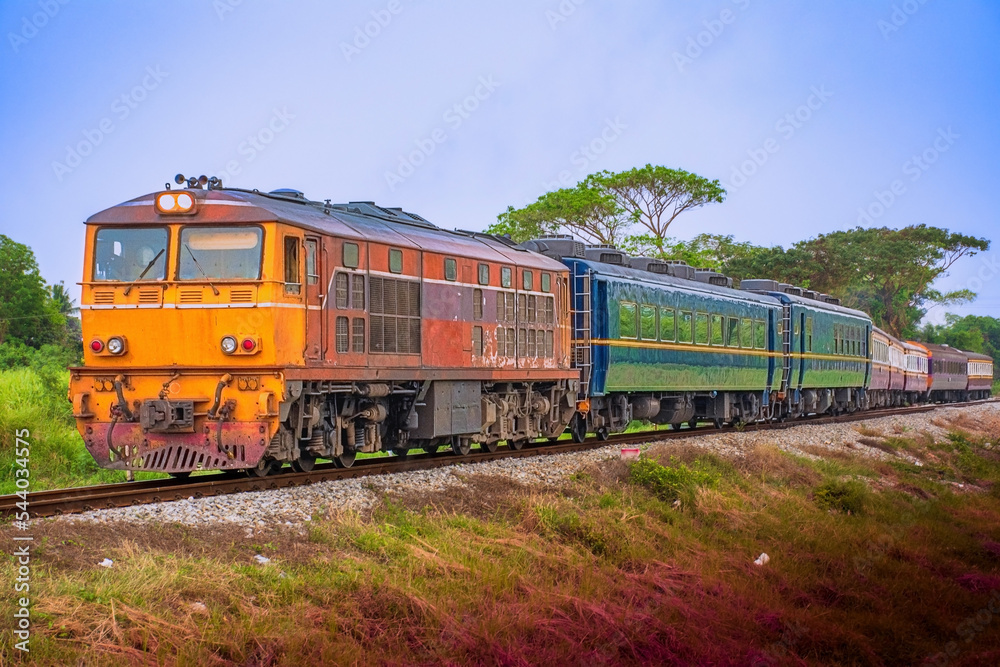 Passenger train by diesel locomotive on the railway. Passenger train by diesel locomotive on the railway.