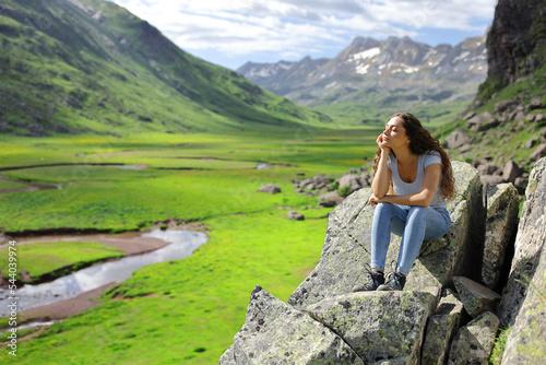 Woman resting and relaxing in the mountain enjoying nature