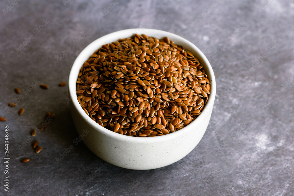 Healthy Flaxseeds in a Bowl on Dark Background, Healthy Food Photography Healthy Flaxseeds in a Bowl on Dark Background, Healthy Food Photography