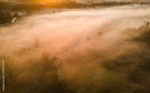 The landscape from the flight of the drone on the river valley is obscured by fog © szczepank
