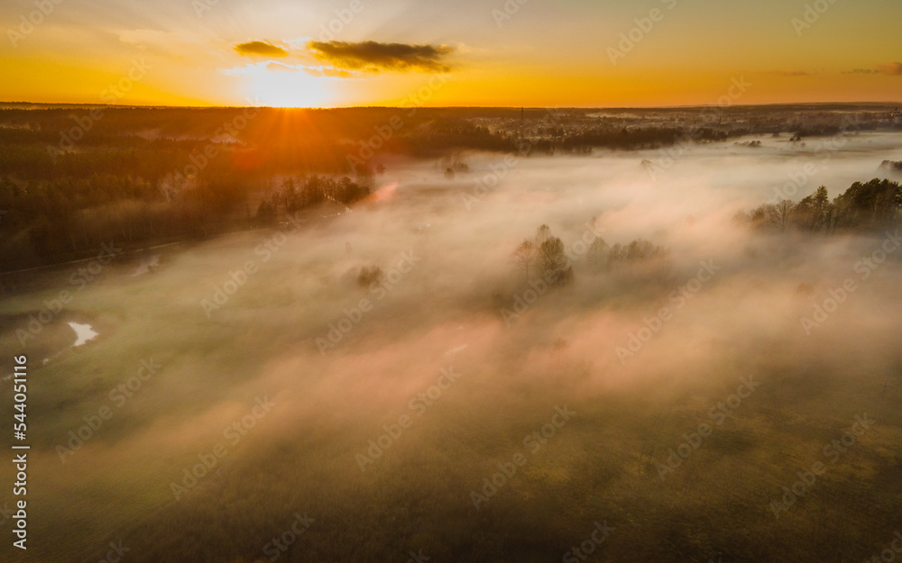 The landscape from the flight of the drone on the river valley is obscured by fog