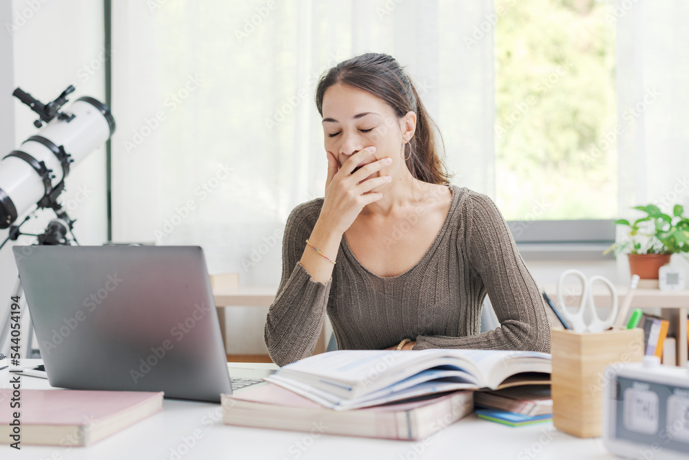 Lazy sleepy student girl yawning Lazy sleepy student girl yawning