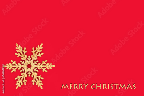 Merry Christmas gold glitter snowflake tree decoration on red background. Minimal traditional design symbol for the festive Xmas holiday season.