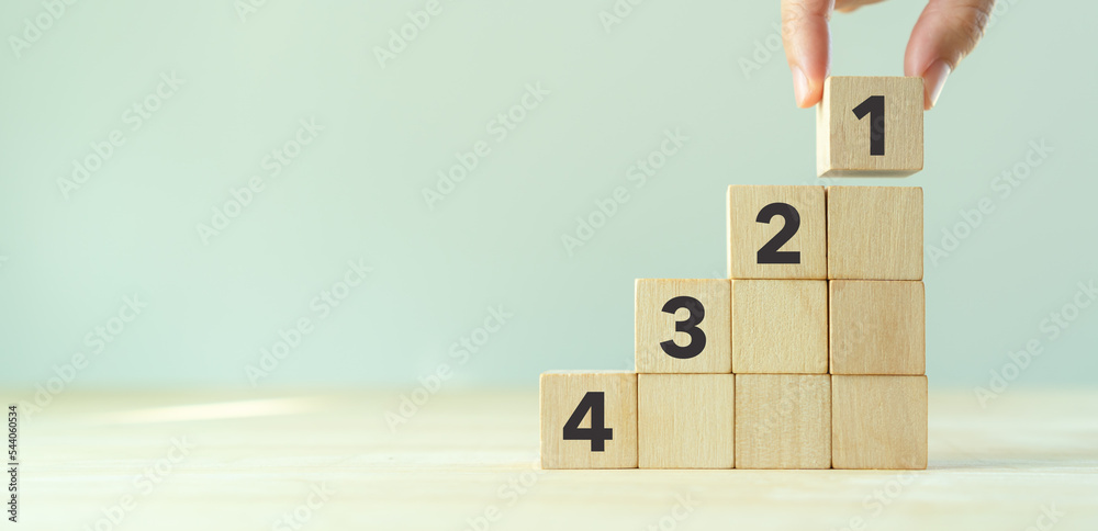 Task priority and management concept. The order of priority in any activity. Set work priority, arrange to do list. Wooden cubes with number first, second, third and fourth. - obrazy, fototapety, plakaty 