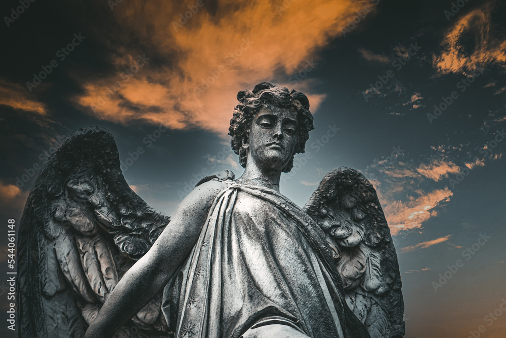 Fototapeta premium Sepulchral sculpture of an angel, judgment, in the monumental cemetery 