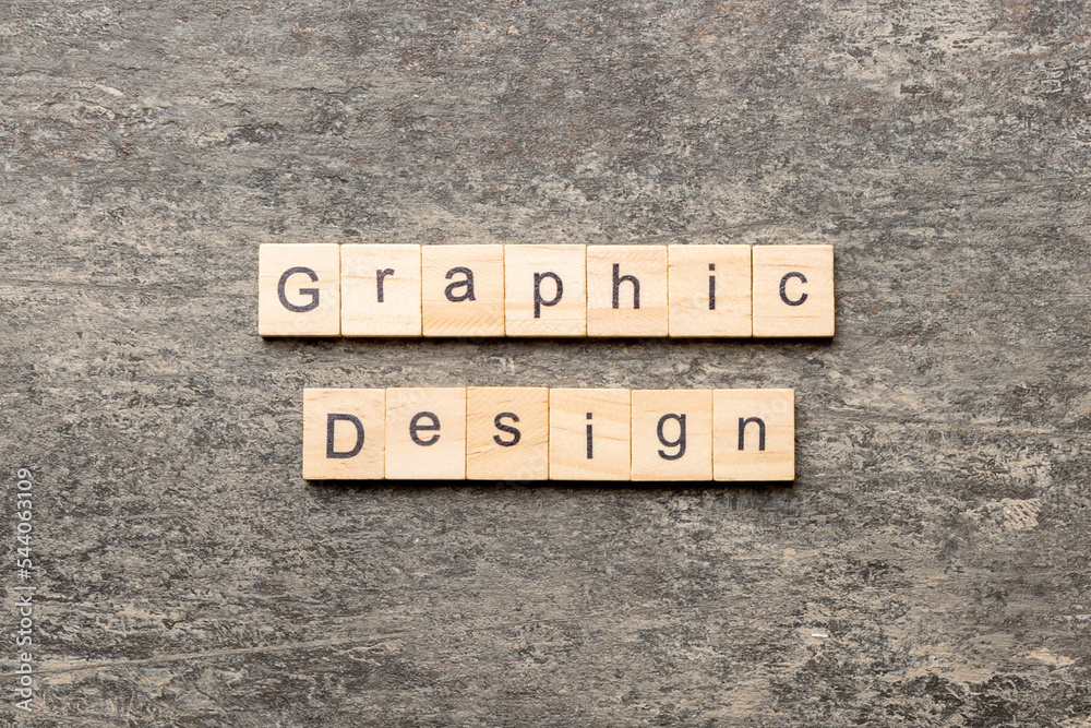 Fototapeta premium graphic design word written on wood block. graphic design text on cement table for your desing, concept