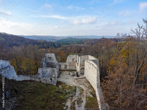 Obraz na płótnie The castle ruins as seen from above. Aerial view. Castle, walls, historical, in forest, trees nature. Photo from a drone. w salonie