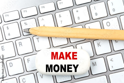 MAKE MONEY text on white paper. the inscription on the notebook