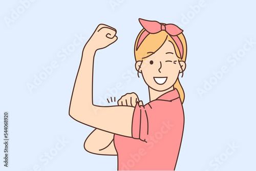 Smiling woman show muscles feeling powerful 