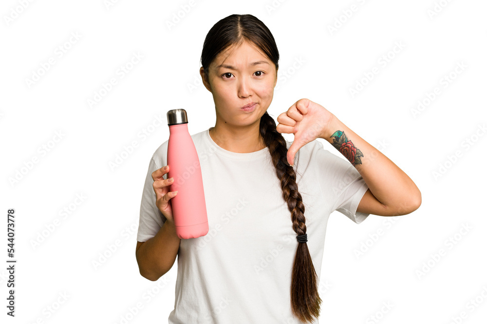 Young asian woman holding a pink thermo isolated showing a dislike gesture, thumbs down. Disagreement concept. Young asian woman holding a pink thermo isolated showing a dislike gesture, thumbs down. Disagreement concept.