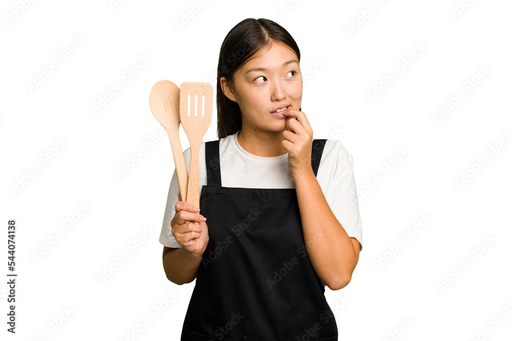 Young asian cook woman isolated relaxed thinking about something looking at a copy space. Young asian cook woman isolated relaxed thinking about something looking at a copy space.