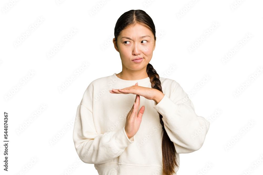 Young Asian woman isolated showing a timeout gesture. Young Asian woman isolated showing a timeout gesture.