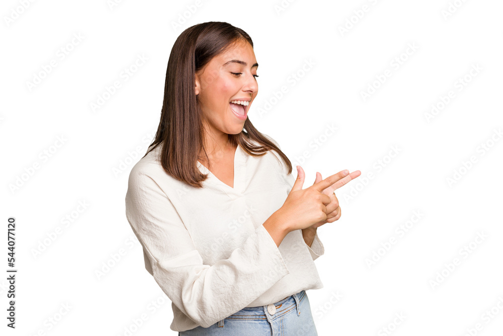 Young cute caucasian woman isolated points with thumb finger away, laughing and carefree. Young cute caucasian woman isolated points with thumb finger away, laughing and carefree.