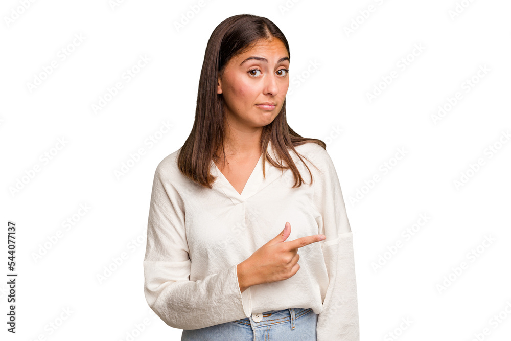 Young cute caucasian woman isolated smiling and pointing aside, showing something at blank space. Young cute caucasian woman isolated smiling and pointing aside, showing something at blank space.