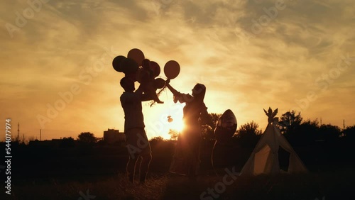 child's lifestyle. happy birthday in autumn field at sunset little kid in tent with cake. photographer shoots a birthday. family and baby joy.