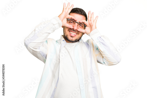 Young caucasian man isolated showing okay sign over eyes