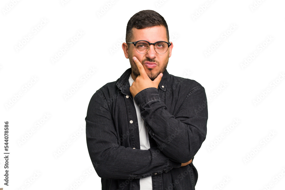 Young caucasian man isolated contemplating, planning a strategy, thinking about the way of a business. Young caucasian man isolated contemplating, planning a strategy, thinking about the way of a business.