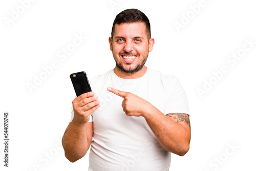 Young caucasian man using mobile phone isolated