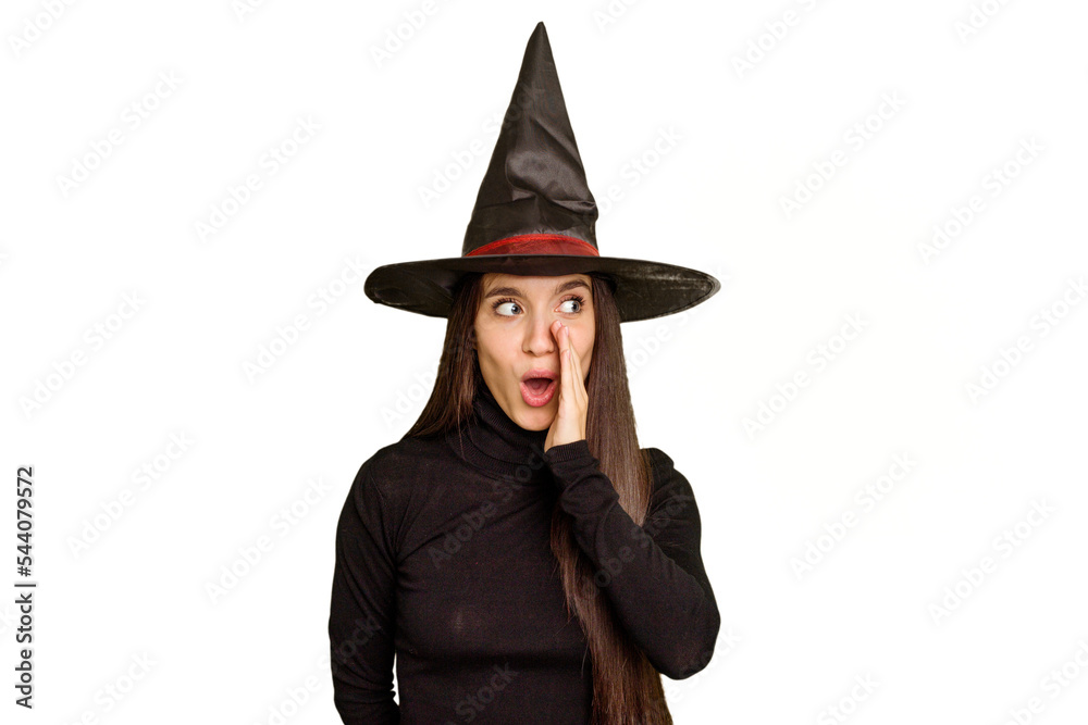Young caucasian woman dressed as a witch for halloween day isolated is saying a secret hot braking news and looking aside Young caucasian woman dressed as a witch for halloween day isolated is saying a secret hot braking news and looking aside