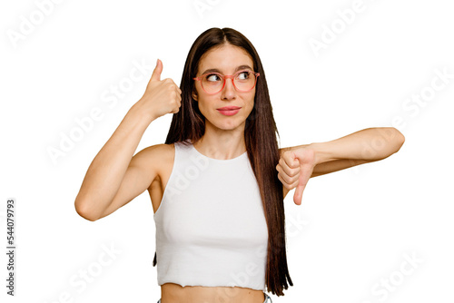 Foto Young caucasian long hair woman isolated showing thumbs up and thumbs down, diff