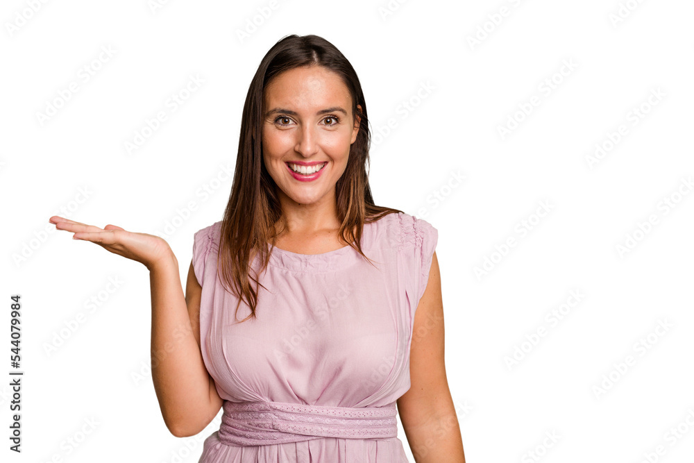 Young caucasian cute woman isolated showing a copy space on a palm and holding another hand on waist. Young caucasian cute woman isolated showing a copy space on a palm and holding another hand on waist.