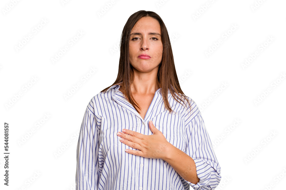 Young caucasian cute woman isolated taking an oath, putting hand on chest. Young caucasian cute woman isolated taking an oath, putting hand on chest.
