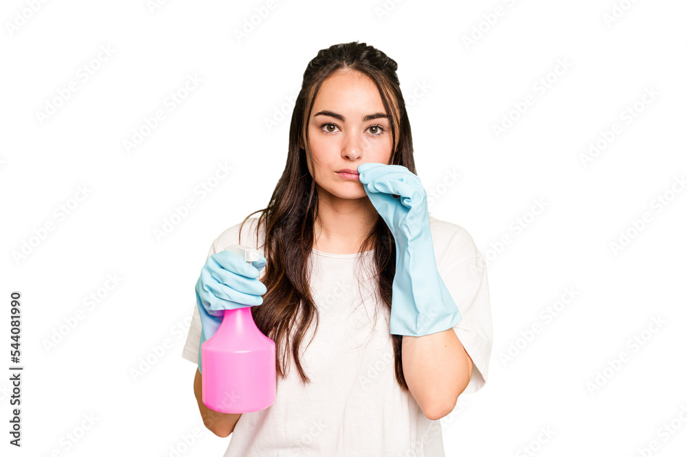 Young cleaner caucasian woman isolated on green chroma background with fingers on lips keeping a secret. Young cleaner caucasian woman isolated on green chroma background with fingers on lips keeping a secret.