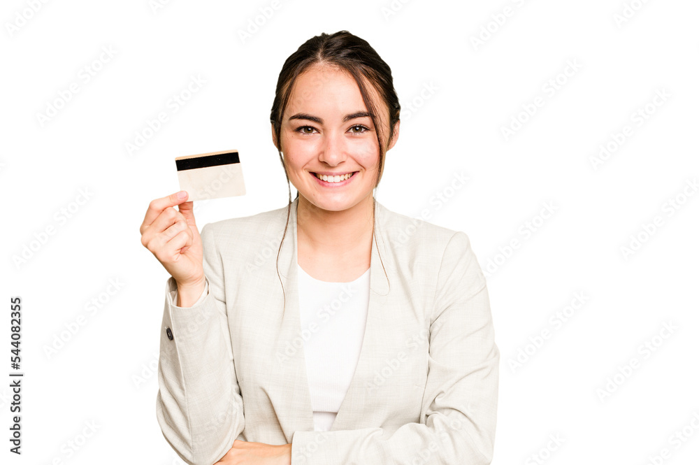 Young caucasian woman holding a credit card isolated on green chroma background laughing and having fun. Young caucasian woman holding a credit card isolated on green chroma background laughing and having fun.