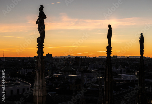Statues of Milan Cathedral at sunset, Statue del Duomo di Milano al tramonto, Italy.
