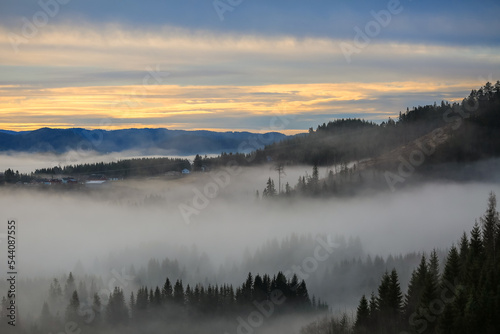 Foggy sunset in the village Bratsberg © liramaigums