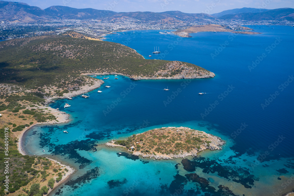 Aerial view of blue sea, islands, yachts along the mediterranean coast. Landscape of turkish riviera nature