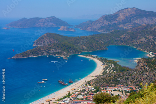 Beautiful mediterranean landscape of sand beach, lagoon, sea and mountains. Oludeniz town aerial view 