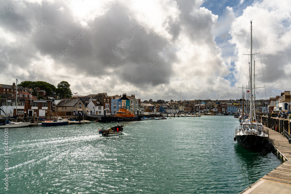 downtown Weymouth and fishing boats on the River Wey in Dorset