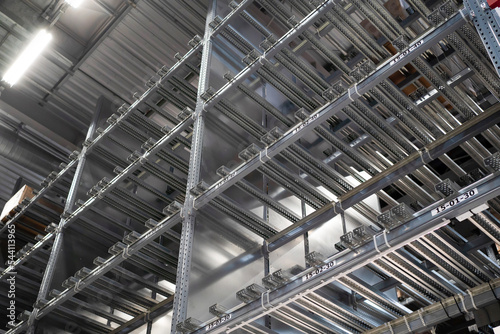 Empty warehouse ineterior with industrial racks pallets shelves. Warehouse background