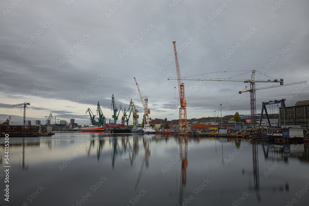 Industrial shipyard with ships and cranes