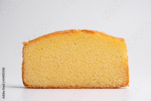 Homemade butter cake slice on isolated white background photo