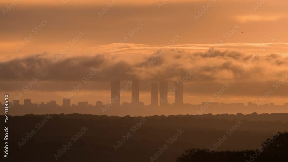 Silhouettes of skyscrapers at sunrise in city Silhouettes of skyscrapers at sunrise in city