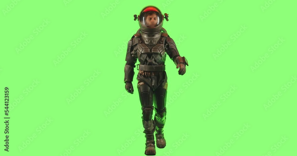 CHROMA KEY Side view of male astronaut wearing a spacesuit walking against green screen CHROMA KEY Side view of male astronaut wearing a spacesuit walking against green screen