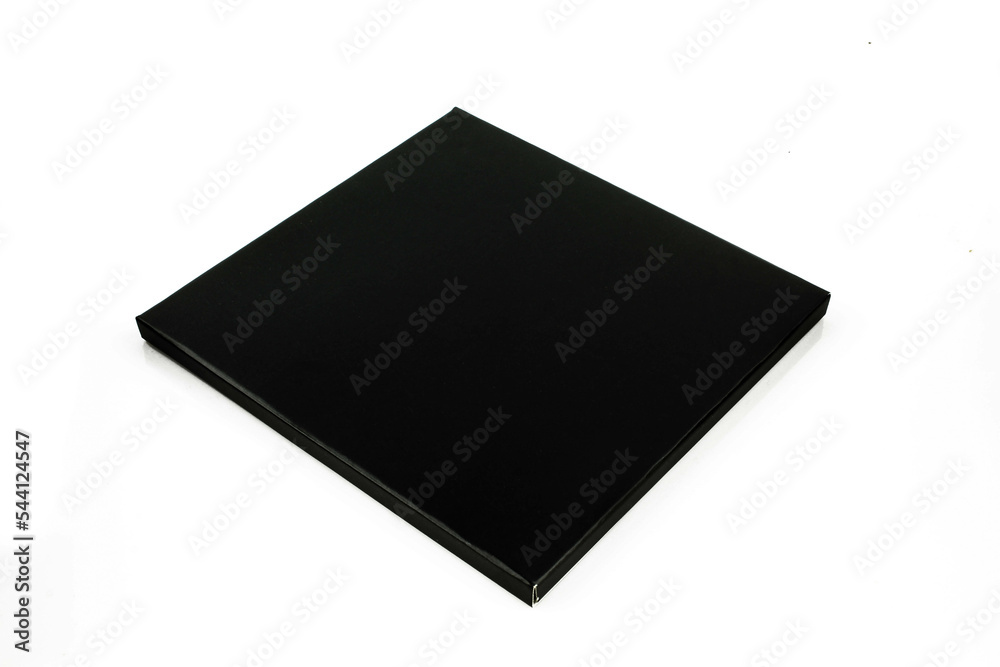 Black and thin square paper box package isolated on white background Black and thin square paper box package isolated on white background