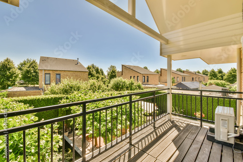 Views of various houses from the metal balcony