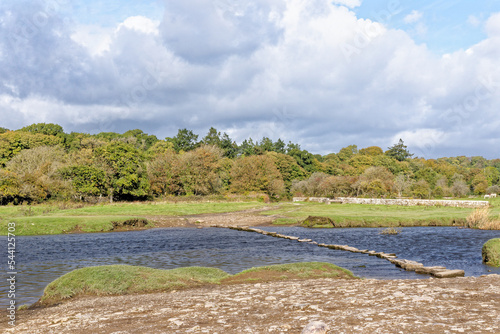 Old stepping stones to cross Ewenny River at Ogmore Castle photo