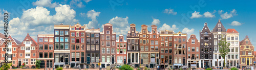 Obraz na płótnie Amsterdam Long Panorama of famous Amsterdam houses with blue sky. Various traditional houses in the historic center of Amsterdam. Amsterdam, Holland, Netherlands, w salonie